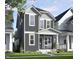 Charming two-story home with gray siding, white trim, a welcoming front porch, and landscaped yard at 111 Weavers Grv Dr, Chapel Hill, NC 27514
