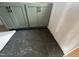 Unfinished kitchen cabinet base with new black and gray tile floor at 111 Weavers Grv Dr, Chapel Hill, NC 27514