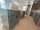 Unfinished kitchen with ample cabinet space, awaiting final touches and appliances at 111 Weavers Grv Dr, Chapel Hill, NC 27514