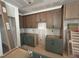 Unfinished kitchen with ample cabinet space, awaiting final touches and appliances at 111 Weavers Grv Dr, Chapel Hill, NC 27514