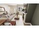 Bright living room featuring a stylish sofa, modern fireplace, large window, and neutral decor at 111 Weavers Grv Dr, Chapel Hill, NC 27514