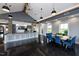 Bright lounge area featuring a long table with seating for eight, and large picture windows at 113 Seagraves Creek Ln, Holly Springs, NC 27540