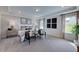 Spacious primary bedroom with neutral color palette, tray ceiling, and large windows for natural light at 113 Seagraves Creek Ln, Holly Springs, NC 27540