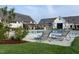 Beautiful community pool area with lounge chairs and clubhouse, surrounded by greenery at 113 Seagraves Creek Ln, Holly Springs, NC 27540
