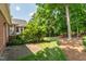 Brick paver patio on a landscaped backyard with a well-maintained lawn and plenty of natural shade from mature trees at 1149 The Preserve Trl, Chapel Hill, NC 27517