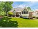 Beautiful backyard featuring a lawn, patio, and brick exterior home with screened-in porch at 1149 The Preserve Trl, Chapel Hill, NC 27517
