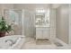 Bright bathroom featuring a glass shower, soaking tub, and updated cabinetry at 1149 The Preserve Trl, Chapel Hill, NC 27517