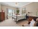 Charming bedroom featuring a four-poster bed and view of the nearby window at 1149 The Preserve Trl, Chapel Hill, NC 27517
