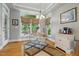 Breakfast nook with surrounding windows and a small breakfast table at 1149 The Preserve Trl, Chapel Hill, NC 27517