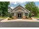 Charming clubhouse exterior with stone accents, columns, and manicured landscaping at 1149 The Preserve Trl, Chapel Hill, NC 27517
