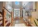 Inviting foyer with hardwood floors, a staircase, and a view of the front door at 1149 The Preserve Trl, Chapel Hill, NC 27517