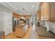 Spacious kitchen featuring granite countertops, stainless steel appliances, and hardwood floors at 1149 The Preserve Trl, Chapel Hill, NC 27517