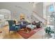 Spacious living room with hardwood floors, comfortable seating, and a view to the kitchen at 1149 The Preserve Trl, Chapel Hill, NC 27517