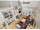 Bright living room with built-in shelving, a fireplace, and large windows with doors to the outside at 1149 The Preserve Trl, Chapel Hill, NC 27517
