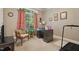 Cozy home office with a large window, wood desk and adjacent exercise area at 1149 The Preserve Trl, Chapel Hill, NC 27517