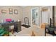 Home office area with desk and treadmill leading to an adjacent bathroom at 1149 The Preserve Trl, Chapel Hill, NC 27517