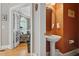Powder room with pedestal sink, and views into the office at 1149 The Preserve Trl, Chapel Hill, NC 27517