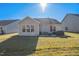 Spacious backyard featuring a patio area with outdoor seating, a grill, and ample open space at 1206 Newton Dr Dr, Mebane, NC 27302