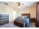 Well-lit bedroom with a spacious bed, chest of drawers, and a view into the en-suite bathroom at 1206 Newton Dr Dr, Mebane, NC 27302