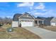 Charming home featuring a two-car garage and landscaped front yard at 1206 Newton Dr Dr, Mebane, NC 27302