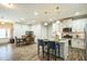 Open-concept kitchen with granite countertops, white cabinetry and stainless appliances at 1206 Newton Dr Dr, Mebane, NC 27302