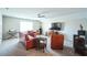 Spacious living room with plush seating, a ceiling fan, and a large flat-screen television at 1206 Newton Dr Dr, Mebane, NC 27302