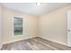 Bedroom featuring gray wood-look floors and a window at 121 Lena Ct, Burlington, NC 27217