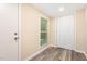 Bright entryway features wood-look flooring, neutral paint, and a window for natural light at 121 Lena Ct, Burlington, NC 27217