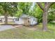Charming one-story home with a cozy front porch and mature trees at 121 Lena Ct, Burlington, NC 27217