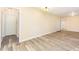 Spacious living room offers natural lighting and durable gray wood-look flooring at 121 Lena Ct, Burlington, NC 27217