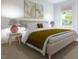 Cozy bedroom with neutral tones, stylish lamps, and a large window providing natural light at 1216 Hardin Hill Ln, Knightdale, NC 27545