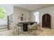 Bright dining room featuring a modern table, chairs, and gallery wall at 1216 Hardin Hill Ln, Knightdale, NC 27545
