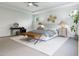 Neutral main bedroom with tray ceiling and sitting area, plus ensuite access at 1216 Hardin Hill Ln, Knightdale, NC 27545
