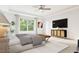 Spacious main bedroom with a large window, tray ceiling, and contemporary decor at 1216 Hardin Hill Ln, Knightdale, NC 27545