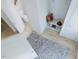 Neat mud room with a storage bench, hooks, and black and white rug at 1216 Hardin Hill Ln, Knightdale, NC 27545