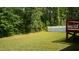 The backyard has a lawn, partial fence, and a deck area at 126 Kipling Dr, Oxford, NC 27565