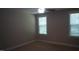 This cozy bedroom features neutral walls, carpet floors, and natural light from the windows at 126 Kipling Dr, Oxford, NC 27565
