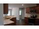 Well-appointed kitchen boasting stainless steel appliances, granite counters, and wood floors at 126 Kipling Dr, Oxford, NC 27565