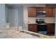 Newly renovated kitchen with granite countertops, stainless steel appliances, and stylish wooden cabinets at 126 Kipling Dr, Oxford, NC 27565