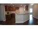 Beautiful kitchen with stainless steel appliances, granite counters, and hardwood floors and adjacent rooms at 126 Kipling Dr, Oxford, NC 27565
