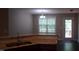 Modern kitchen featuring granite countertops, stainless sink and faucet, and a view to the exterior at 126 Kipling Dr, Oxford, NC 27565