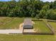 This home has a fenced in yard and gravel driveway, shown in an aerial view at 130 Ruby Trl, Roxboro, NC 27574