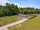 Aerial view of a home with fenced-in backyard and gravel driveway at 130 Ruby Trl, Roxboro, NC 27574