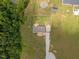 A top-down aerial view shows the home has a spacious lot with a gravel driveway at 130 Ruby Trl, Roxboro, NC 27574