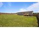 This home has a large fenced-in backyard with a wooden deck at 130 Ruby Trl, Roxboro, NC 27574