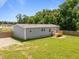 Angle of the home's backyard featuring the wooden deck and fenced-in backyard at 130 Ruby Trl, Roxboro, NC 27574