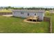 Exterior elevation featuring lawn, deck, and siding at 130 Ruby Trl, Roxboro, NC 27574