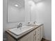 Bathroom with double sink vanity, framed mirrors and light wood cabinets at 130 Ruby Trl, Roxboro, NC 27574