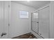 Bathroom featuring sliding glass shower door and natural light from a window at 130 Ruby Trl, Roxboro, NC 27574
