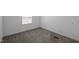 Carpeted bedroom with natural light from a window at 130 Ruby Trl, Roxboro, NC 27574